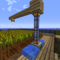 Here's the most complicated part of the whole build, but it's super easy! All you need is 2 water source blocks (I sure hope you have an infinite water source by now) on either side of an Aqueous...